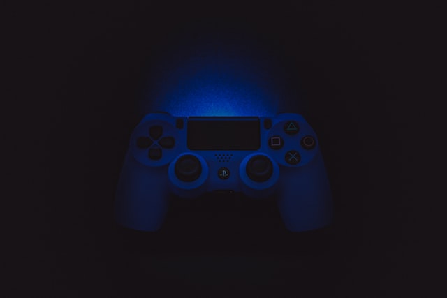 video game controller in dark blue lighting